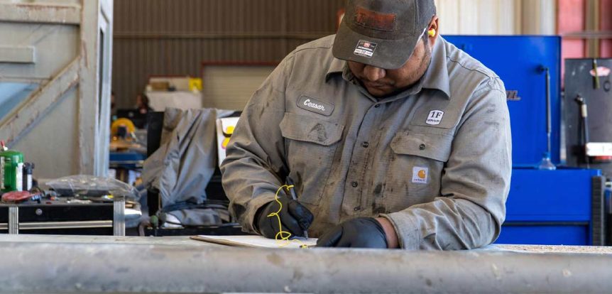 first fleet services employee conducting a vehicle inspection